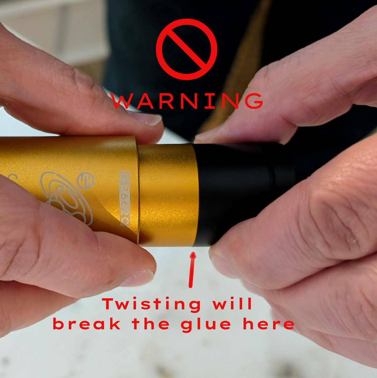 Warning: Never twist the front of the camera against the golden part